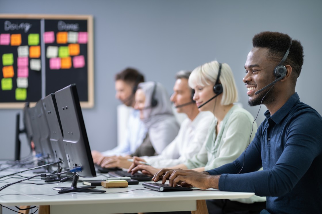 BPO contact center agents working with AI technology